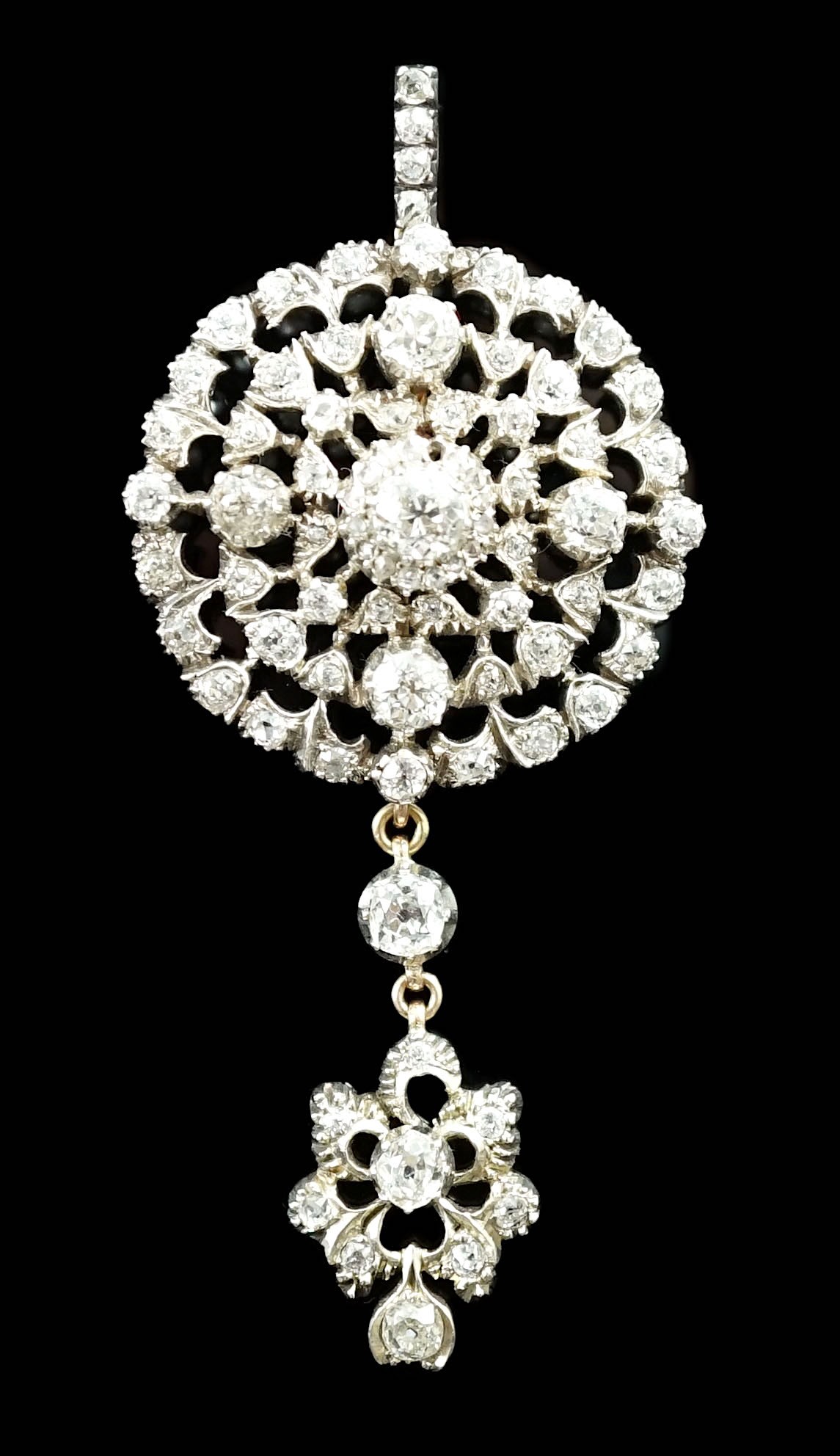 A good Victorian gold, silver and graduated diamond cluster set target drop pendant brooch, retailed by Carlo & Arthur Giuliano